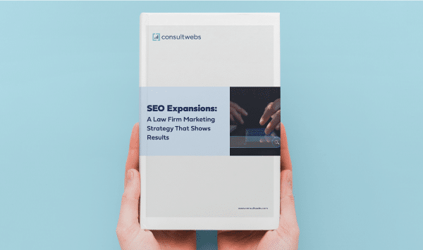 Brochure on SEO strategies for law firms held against a light blue background.